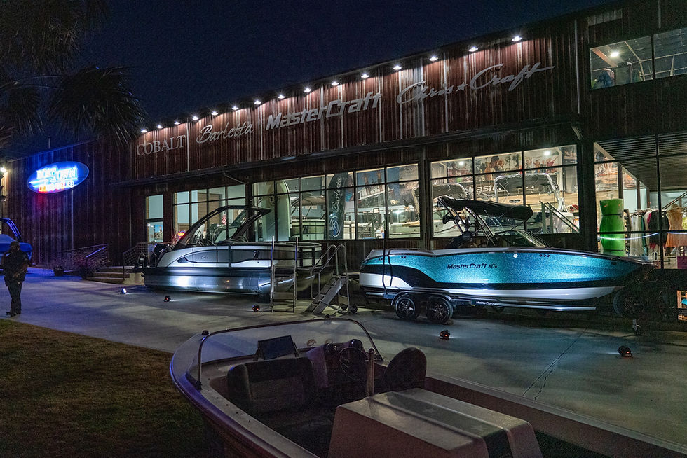 Barletta and MasterCraft boat at night at Boat Town on Lake LBJ