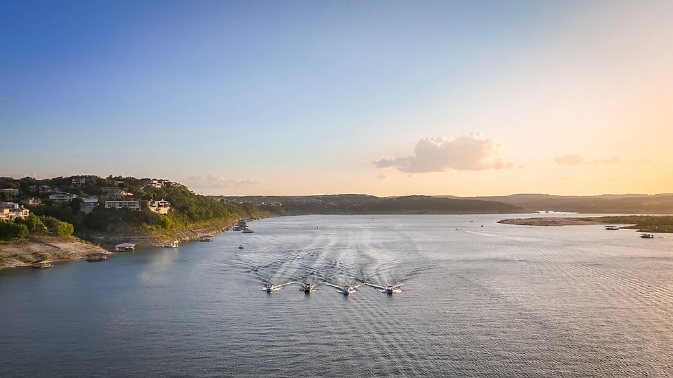 Barletta, Cobalt, and MasterCraft boat on Lake Travis at Sunset